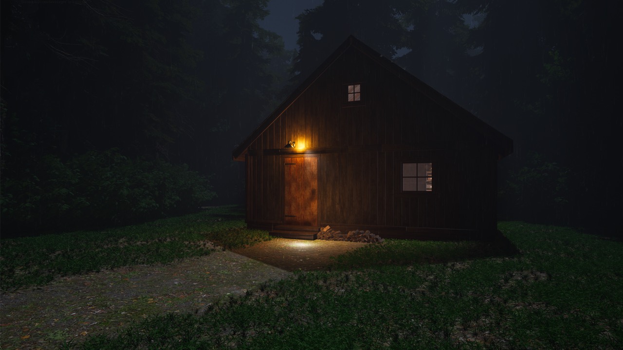 The timber workshop at night, surrounded by trees, with a warm light over the door.
